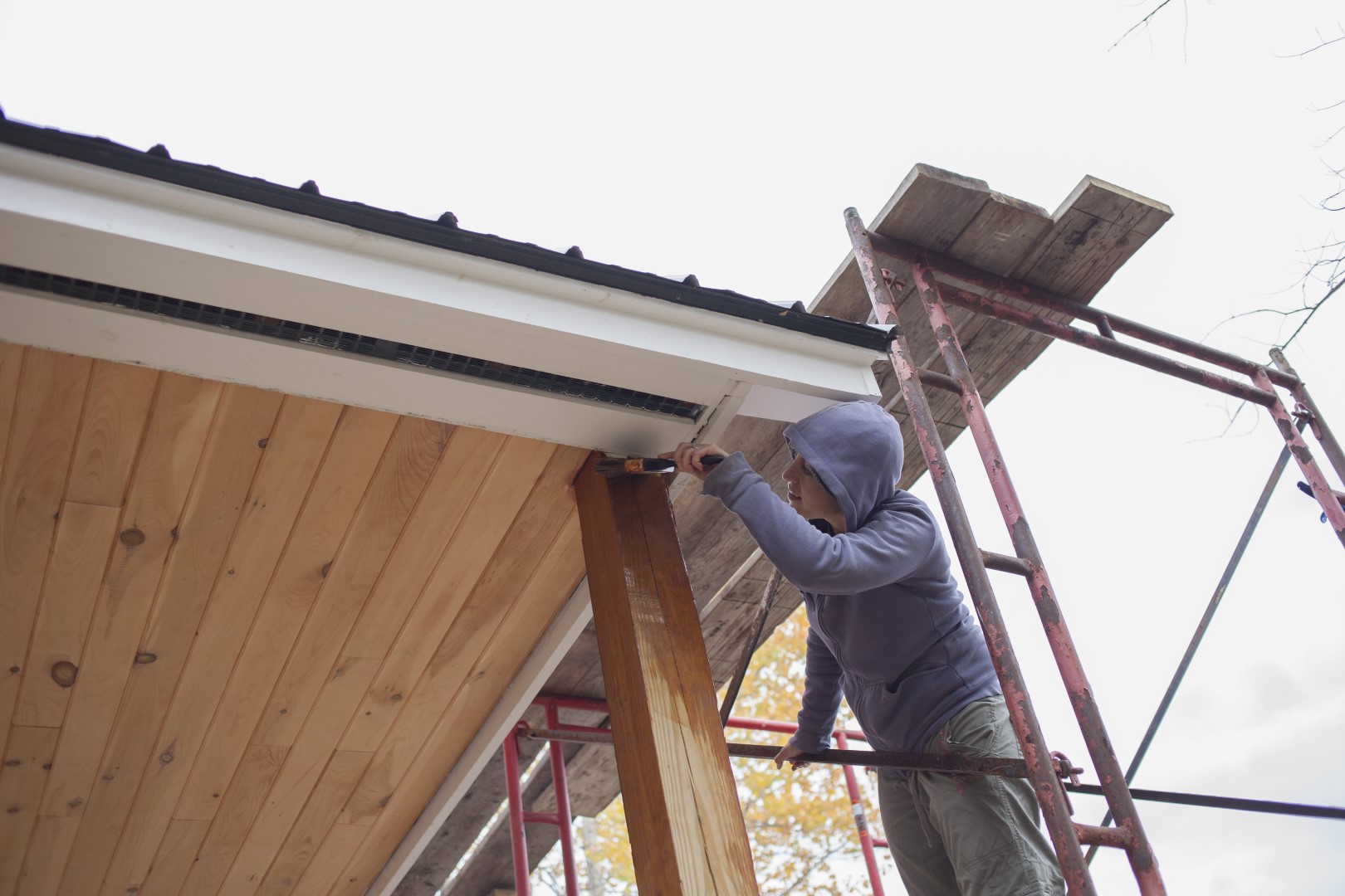 construction worker painting exterior wood on buil 2026 03 11 00 56 27 utc Large